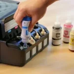Filling printer ink tank to check how many pages can I print with one ink cartridge efficiently